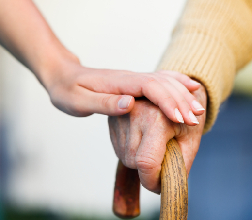 Mira Vie retirement community, where compassionate assistance to seniors with walking canes symbolises our commitment to care and support.