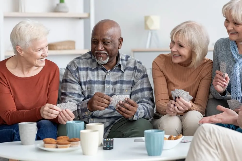 Social card games at our senior living community where you'll often find residents bonding, laughing, and smiling together.