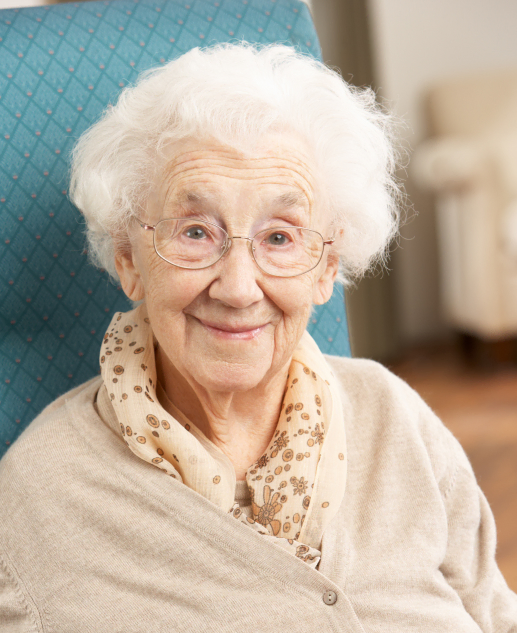 Smiling elderly lady with glasses enjoying her time at Mira Vie at Green Knoll Retirement Community.