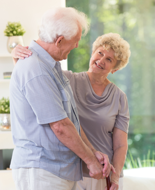 Affectionate elderly couple shares a tender moment at Mira Vie at Brookfield Retirement Home. This heart-warming gesture reflects the compassionate community we strive for and promote.