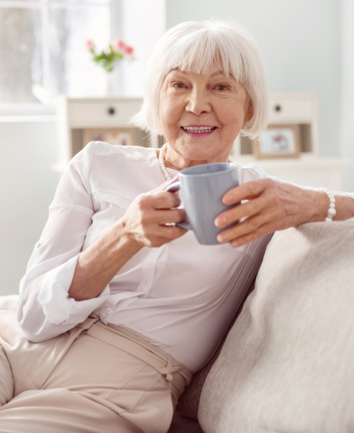 A relaxed lifestyle at Mira Vie at Brookfield, where our radiant elderly residents can unwind on cozy sofas with a soothing cup in hand.