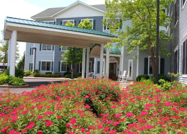 Visit Mira Vie retirement community, where modern residence buildings are complemented by beautifully maintained entrances and vibrant flowerbeds. For more info, reach out to Mira Vie.