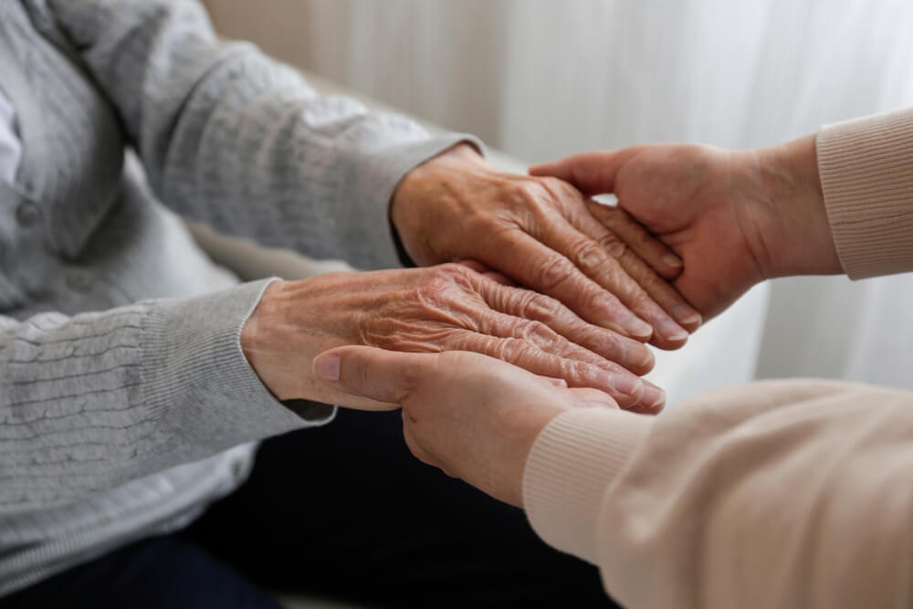 Warm, supportive companionship in our retirement community, emphasizing comforting human connections within an assisted living environment for seniors.