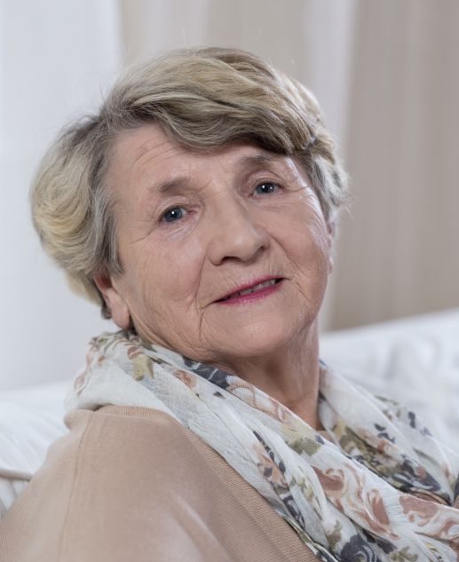 Smiling elderly lady with short hair enjoys life at Mira Vie Manalapan Retirement Community.