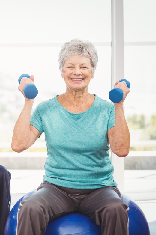 Engaging wellness programs in our retirement community, with activities like senior women's seated fitness ball exercise with dumbbells.