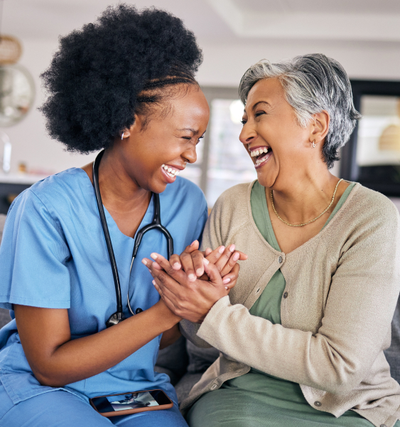 Joy at Mira Vie Retirement Home, where our dedicated nurses engage heartwarmingly with our senior female residents.