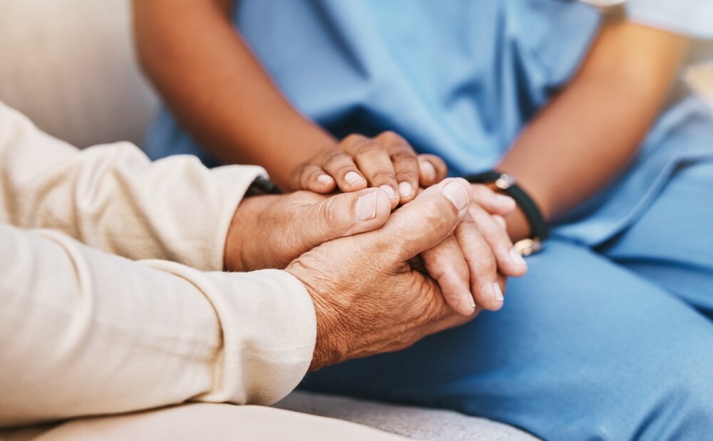 Medical professional comforts resident at a skilled nursing facility