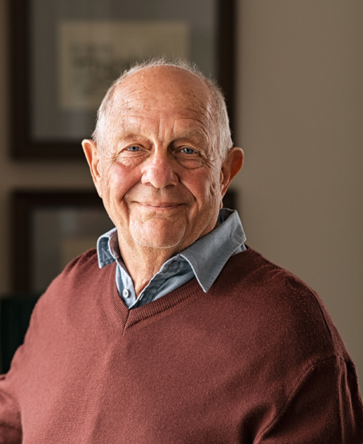 Senior citizen joyfully posing for an indoor portrait at Mira Vie Retirement Community in Tinton Falls.