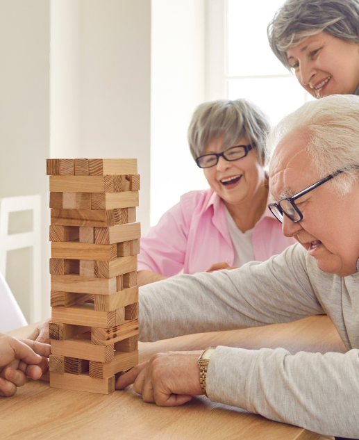 Lively games like wooden block-stacking with peers at Mira Vie Retirement Community in Tinton Falls. Our senior residents love engaging in fun activities while sharing laughter and joy.