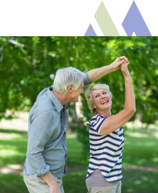 Elderly couple joyfully dancing at the Toms River Mira Vie Retirement Community Park.