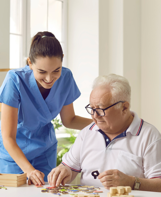 Engaging activities like puzzle games with friendly healthcare staff at Mira Vie at Warren, a premier retirement community that prioritizes joy and personal assistance in senior living.