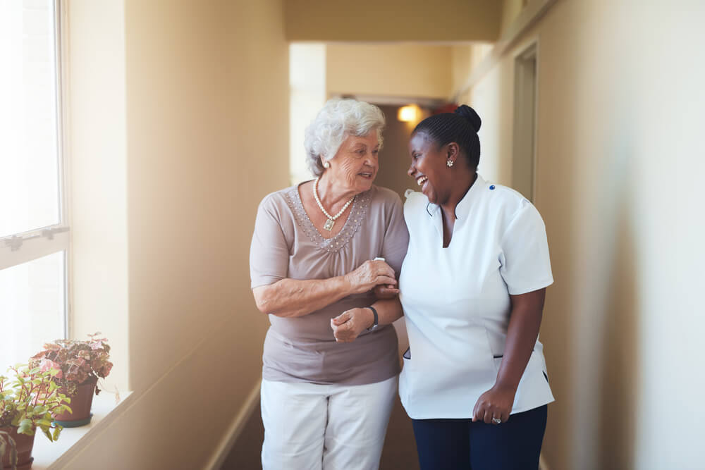 Assisted Living resident with caregiver