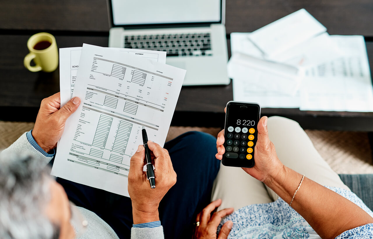 Two seniors calculating Senior Living costs