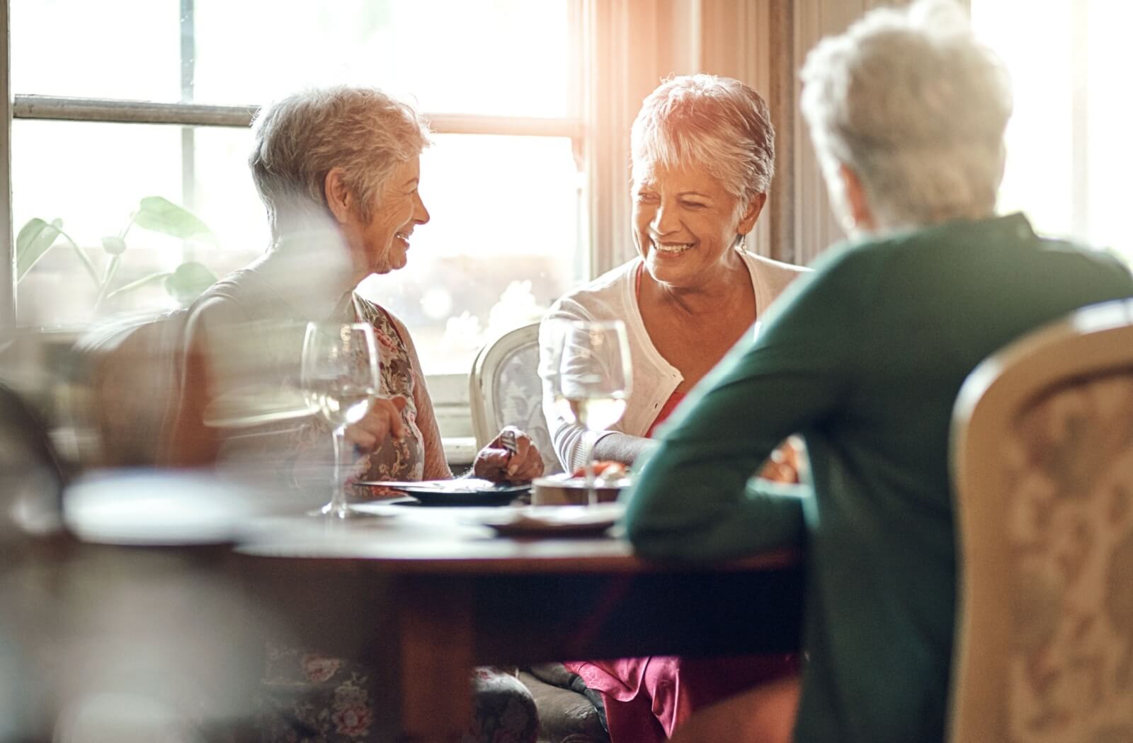 A group of seniors enjoying a meal together at a senior living community
