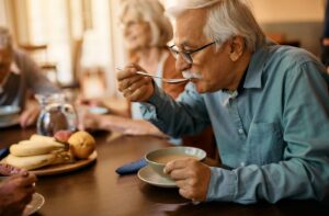 Senior enjoying a hearty bowl of soup.